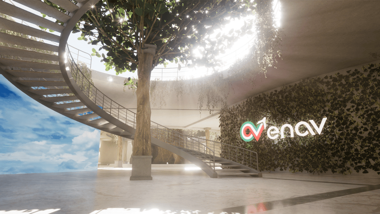 At the bottom in the center a tree beyond the ceiling, and a semicircular staircase leading to the upper floor. At right, a wall covered with plants and an ENAV logo 